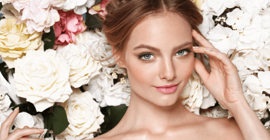 Female model with smooth skin against a floral background